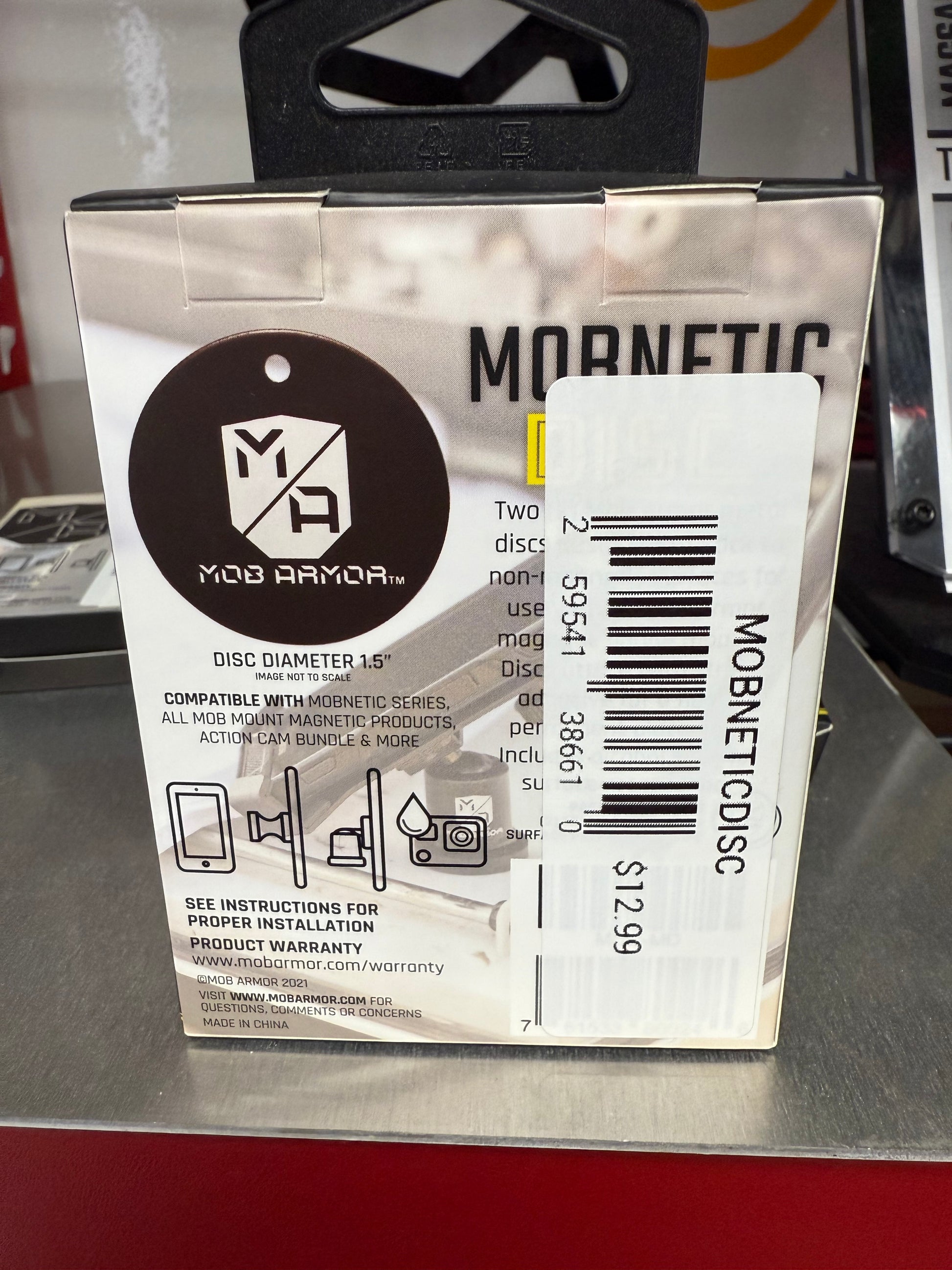 Already have a Mob Armor Mobnetic Mount? This Mobnetic Discs is the perfect replacement or add-on to your existing kit. Designed to work seamlessly with all Mobnetic phone mounts, this metal disc allows you to quickly and securely attach your device in multiple vehicles or locations

"NOTE: THIS IS ONLY THE TWO DISCS. THE FULL MOBNETIC MOUNTING KIT IS SOLD SEPERATELY"   Back Side of Product packaging