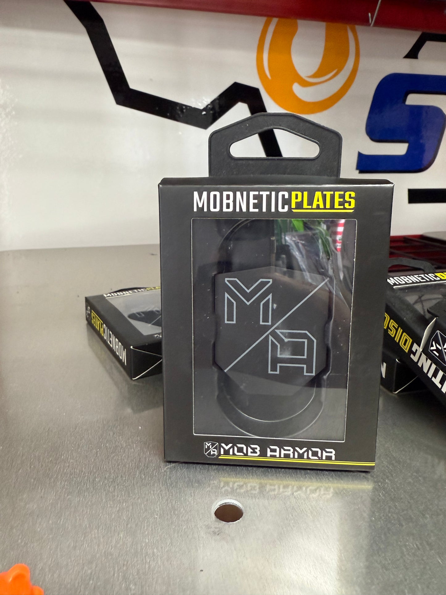 Expand your mounting options with the Mob Armor Mobnetic Plates. These steel replacement plates are designed to work with ant Mob Armor Mobnetic mount, allowing you to easily attach your device in multiple vehicles, toolboxes, or workstations. Perfect for drivers who use their mount across several setups.

NOTE: THIS PRODUCT INCLUDES 2 PLATES ONLY. MOBNETIC MOUNT SOLD SEPERATLEY. FRONT VIEW OF PACKAGING