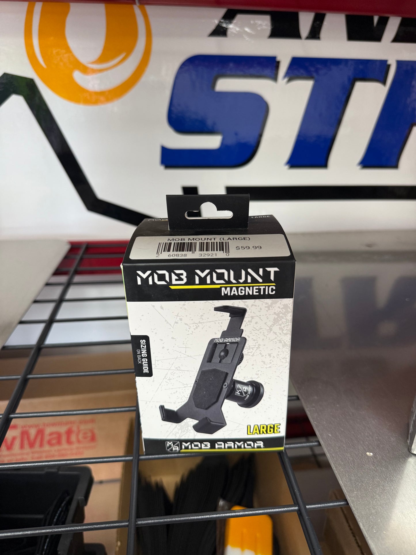 Keep your phone secure in any environment with the Mob Armor Mob Mount Magnetic (LARGE). Built for strength and reliability, this rugged mount uses a powerful rare-earth magnet to keep your phone locked in place- weather you're towing, hauling, or hitting the trails. FRONT VIEW OF PACKAGING